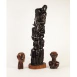 AFRICAN CARVED EBONY GROUP, modelled as numerous figures standing and sitting on top of each