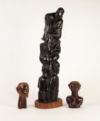 AFRICAN CARVED EBONY GROUP, modelled as numerous figures standing and sitting on top of each
