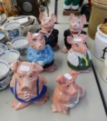 NAT WEST PIG MONEY BOXES, FULL FAMILY SET OF FIVE PIGS, WADE, ORIGINAL STOPPERS AND AN EXTRA 'DAD'