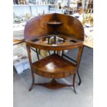 A GEORGE III MAHOGANY CORNER WASH STAND OF THREE TIERS AND THREE SMALL DRAWERS