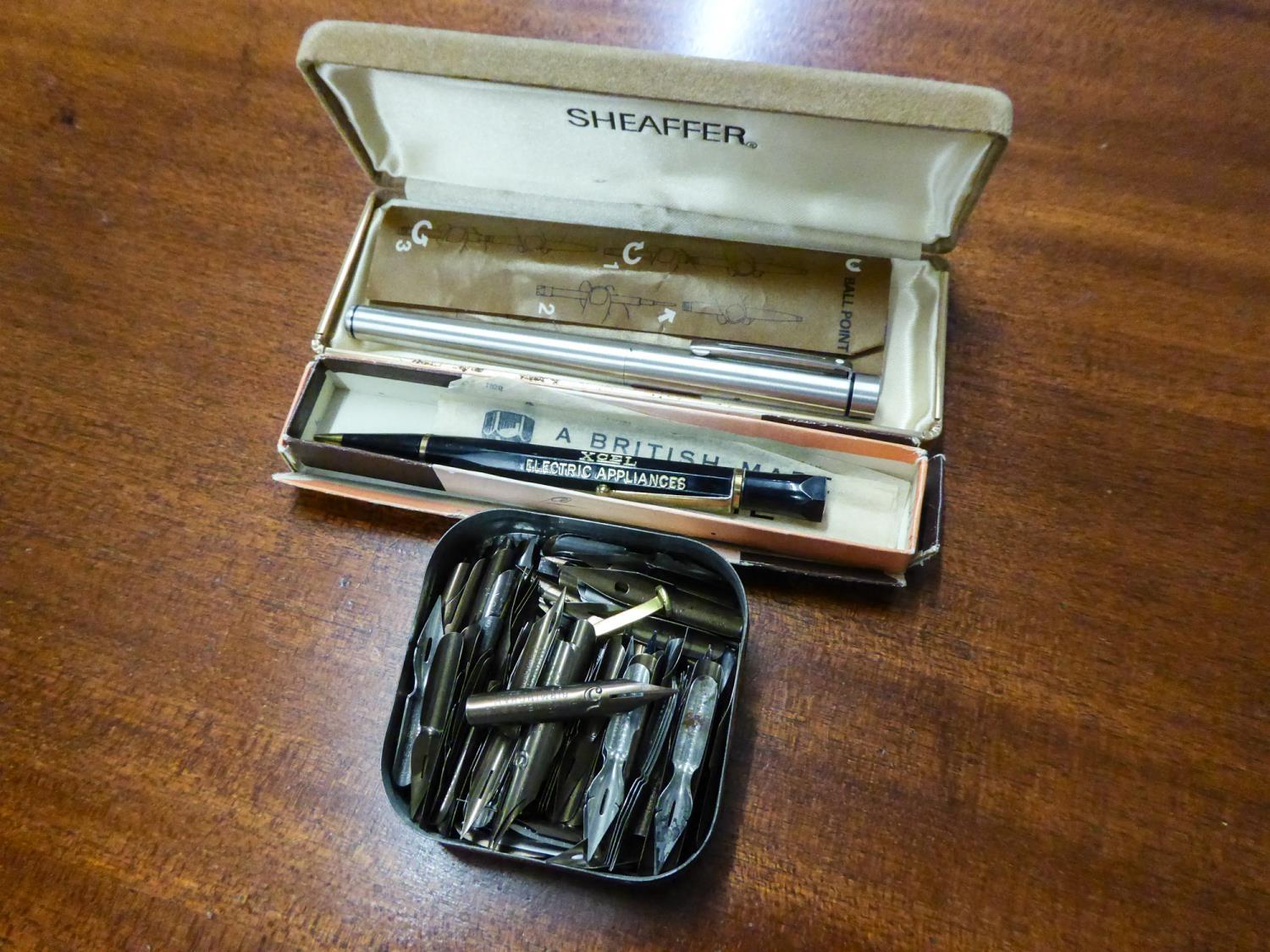 A BOXED SHEAFFER  FOUNTAIN PEN, BOXED PROPELLING PENCIL AND A TIN OF PEN NIBS