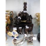 A PAIR OF INDIAN CARVED EBONY ELEPHANT BOOKENDS; AN EBONY ELEPHANT TABLE LAMP; A COPPER MODEL OF A