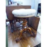 A VICTORIAN WALNUTWOOD ADJUSTABLE MUSIC STOOL