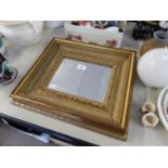 A SMALL RECTANGULAR BEVELLED EDGE WALL MIRROR IN GILT FRAME