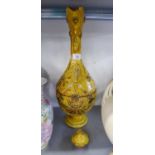 A TIN GLAZED TERRACOTTA LARGE EWER AND STOPPER WITH YELLOW GLAZE AND APPLIED PRINTS, 20" HIGH