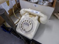 A CREAM PLASTIC VINTAGE G.P.O. TELEPHONE HANDSET WITH ROTARY DIAL