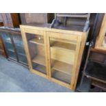 OAK DWARF BOOKCASE, ENCLOSED BY TWO GLAZED DOORS