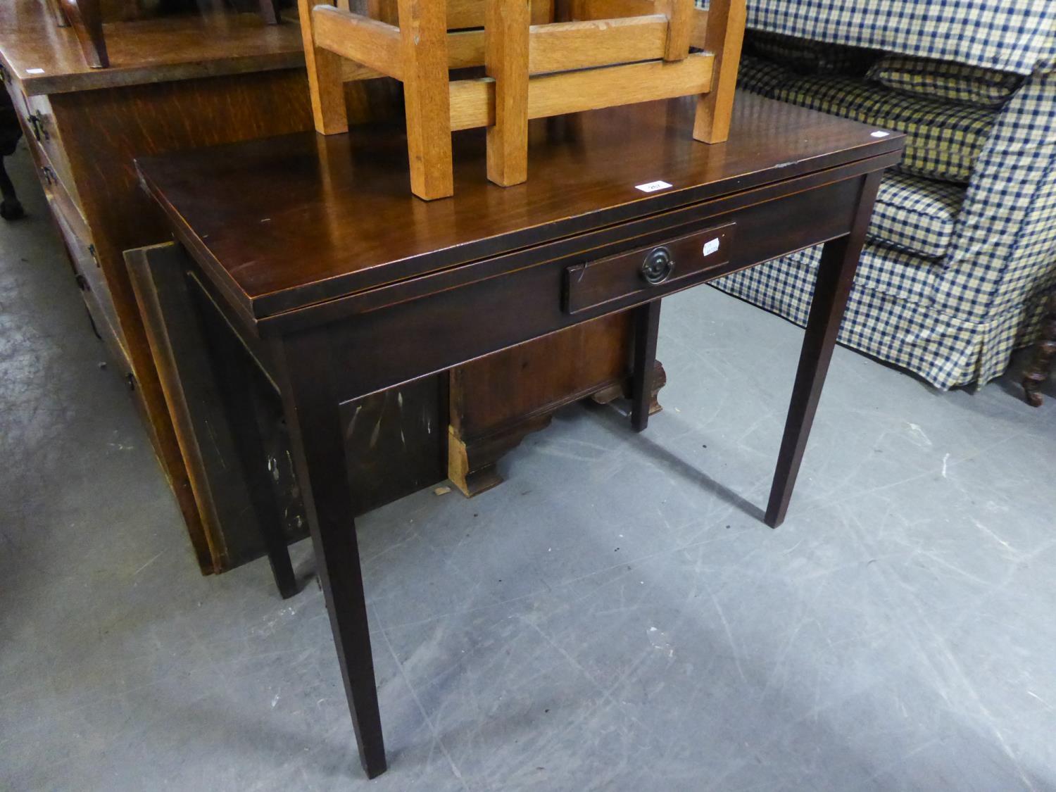 AN EARLY 19TH CENTURY MAHOGANY OBLONG FLAP-TOP TABLE WITH BOX WOOD STRINGING TO THE EDGES, ONE SMALL