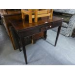 AN EARLY 19TH CENTURY MAHOGANY OBLONG FLAP-TOP TABLE WITH BOX WOOD STRINGING TO THE EDGES, ONE SMALL