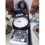 A CIRCULAR WALL CLOCK IN BLACK CASE, A CIRCULAR BAROMETER IN STONE CASING, OTHER MANTEL AND ALARM