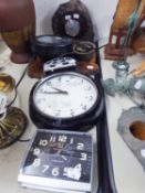 A CIRCULAR WALL CLOCK IN BLACK CASE, A CIRCULAR BAROMETER IN STONE CASING, OTHER MANTEL AND ALARM