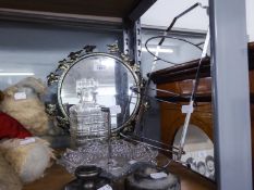 AN ELECTROPLATE THREE TIER CAKE STAND, TWO METAL RAILWAY DOOR STOPS, A SMALL CIRCULAR MIRROR, A