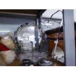 AN ELECTROPLATE THREE TIER CAKE STAND, TWO METAL RAILWAY DOOR STOPS, A SMALL CIRCULAR MIRROR, A