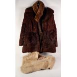 RED BROWN DYED MUSQUASH THREE QUARTER LENGTH COAT with revered collar, three button front with two