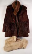 RED BROWN DYED MUSQUASH THREE QUARTER LENGTH COAT with revered collar, three button front with two