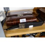 A CUT THROAT RAZOR AND A CROCODILE TOILET CASE WITH FITTINGS