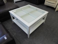 A MODERN WHITE FINISH GLASS TOP DISPLAY TABLE WITH LARGE TWO WAY DRAWER