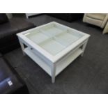 A MODERN WHITE FINISH GLASS TOP DISPLAY TABLE WITH LARGE TWO WAY DRAWER