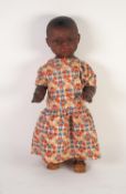 HEUBACH KOPPELDORF BISQUE SWIVEL HEADED BLACK GIRL DOLL with pierced ears, brown sleeping eyes and