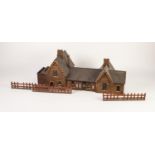 VINTAGE 'O' GAUGE BALSA WOOD AND PRINTED PAPER MODEL OF NINETEENTH CENTURY STATION BUILDING, with