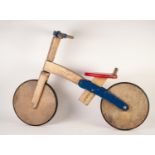 LATE 20th CENTURY CHILD'S PAINTED WOOD BALANCE BIKE, natural wood and blue with simple red painted