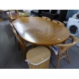 A LARGE EXTENDING POSSIBLY DANISH TEAK EXTENDING DINING TABLE AND FOUR TEAK DINING CHAIRS (5)