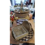 A LARGE CIRCULAR WICKER TRAY, SIX WICKER BASKETS VARIOUS AND A HAT BOX CONTAINING SMALLER BOXES