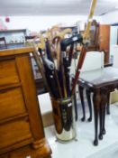 A METAL CYLINDRICAL STICK STAND, 15 WALKING STICKS AND TWO UMBRELLAS