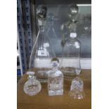 A PLAIN GLASS CLARET JUG; A PLAIN CONICAL WINE DECANTER; ROYAL SCOT CUT CRYSTAL SQUARE PERFUME