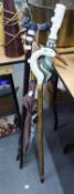 TWO WALKING STICKS WITH ANIMAL DESIGN HANDLES AND THREE UMBRELLAS (5)