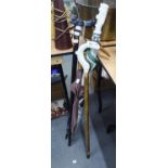 TWO WALKING STICKS WITH ANIMAL DESIGN HANDLES AND THREE UMBRELLAS (5)