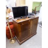 A WALNUT LARGE TWO DOOR TELEVISION CABINET  AND A SAMSUNG FLATSCREEN TELEVISION, 24? AND A SONY