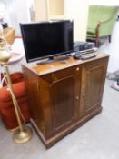 A WALNUT LARGE TWO DOOR TELEVISION CABINET  AND A SAMSUNG FLATSCREEN TELEVISION, 24? AND A SONY