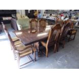 A CONTINENTAL WALNUT DINING ROOM SUITE OF 9 PIECES, TO INCLUDE; EXTENDING DINING TABLE WITH TWO