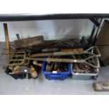 A LARGE QUANTITY OF VARIOUS OLD TOOLS TO INCLUDE; GARDEN FORK, SLEDGE HAMMER, SAWS, SCREW DRIVERS