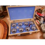 A CHROME PLATED STEEL BOULES SET, IN WOODEN CASE
