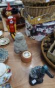 WOODEN DOLL 'PINOCCHIO', TERRACOTTA POT, STONE MODEL OF A HEDGHOG AND A WOODEN BRUSH IN THE DESIGN