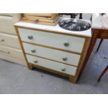 ART DECO LIGHT OAK CHEST OF THREE LONG DRAWERS WITH WHITE PAINTED SURFACES AND SHOW WOOD FRAMES