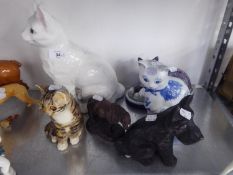 FOUR POTTERY MODELS OF SEATED CATS, BLACK PLASTER MODEL OF A SCOTTY DOG AND A BRONZE FINISH RESIN