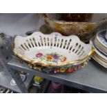 MODERN GERMAN FLORAL ENCRUSTED AND PIERCED PORCELAIN OVAL BASKET, with hand painted floral centre,