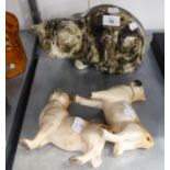 A POTTERY MODEL OF A CAT AND A PAIR OF STAFFORDSHIRE DOGS STANDING (ONE LEG BROKEN)