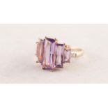 9ct GOLD DRESS RING set with five emerald cut amethysts graduating from the centre, a tiny diamond