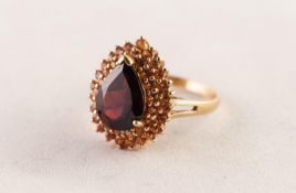 9ct GOLD DRESS RING set with a tear shaped garnet and a two tier surround of tiny citrines, 6.2 gms,