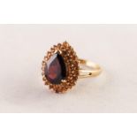 9ct GOLD DRESS RING set with a tear shaped garnet and a two tier surround of tiny citrines, 6.2 gms,