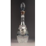 CUT GLASS SKITTLE SHAPED DECANTER AND STOPPER WITH SILVER COLLAR, flash cut with a central floral