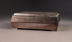 GEORGE V ENGINE TURNED SILVER CLAD TABLE CIGARETTE BOX, of oblong form with angled sides, stepped