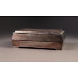 GEORGE V ENGINE TURNED SILVER CLAD TABLE CIGARETTE BOX, of oblong form with angled sides, stepped