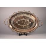 TWO HANDLED ELECTROPLATED OVAL TEA TRAY, with pierced, wavy border and foliate engraved centre,