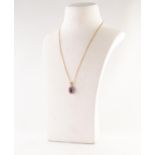 9ct GOLD, AMETHYST AND DIAMOND SMALL OVAL PENDANT, set with a centre oval amethyst and surround of