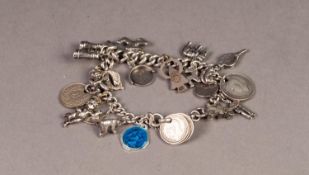 SILVER CURB PATTERN BRACELET, with swivel clip clasp and approximately 20 SILVER AND METAL CHARMS